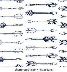 Vector seamless pattern with hand drawn tribal arrows. Beautiful ethnic design elements.