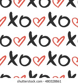 Vector seamless pattern with hand drawn word XOXO and heart. Cute print.