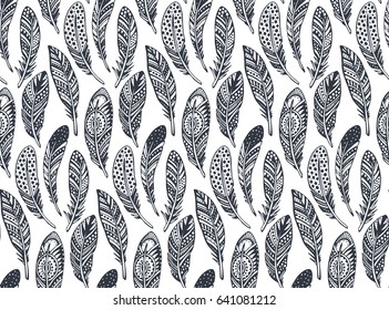 Vector seamless pattern with hand drawn ornate tribal black feathers on a white background. Ethnic endless illustration.