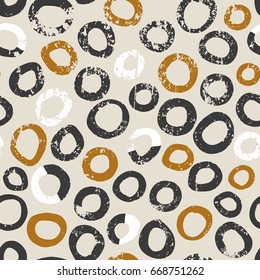 Vector seamless pattern. Hand drawn dots background. Messy grunge circles shapes textured print. 