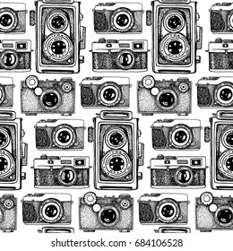 Vector seamless pattern with hand drawn vintage cameras. Beautiful design elements.