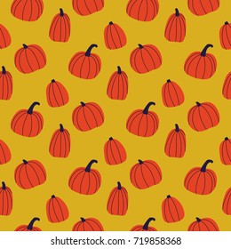 Vector seamless pattern with hand drawn pumpkins. Halloween background. Great print for wrapping paper