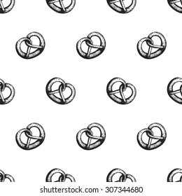 Vector seamless pattern with hand-drawn pretzels.Traditional Oktoberfest snack isolated on white. Oktoberfest celebration design.