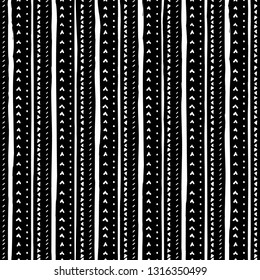 Vector seamless pattern with handdrawn stripes and triangles . Hand drawn white stripes, triangles and lines on black background.