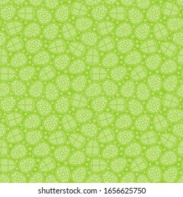 Vector seamless pattern for happy Easter day. Beautiful eggs with decorative carved ornament and flowers on a green background. Repeating texture for wallpaper design, website, print, textile, wrap. 