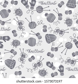 Vector seamless pattern with hats, mittens, balls of yarn and knitting needles. Background on the theme of hobby and knitting