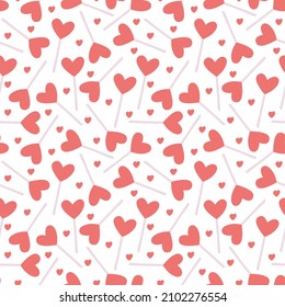 Vector seamless pattern with heart shaped lollipops on white. Great for fabrics,  Valentine's day  wrapping papers.