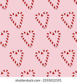 Vector seamless pattern with heart-shaped candy canes on a pink background