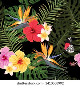 Vector seamless pattern with hibiscus flowers and palm leaves on black background