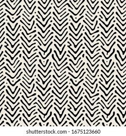 Vector seamless pattern. Hipster monochrome print with hand drawn chevron. Trendy graphic design.