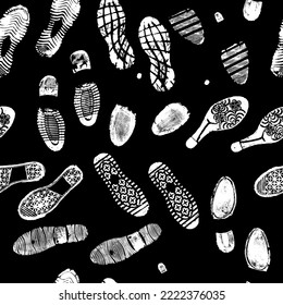 Vector seamless pattern image double footprints white footprints on black background