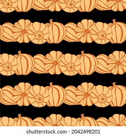 vector seamless pattern with the image of pumpkins on a black background