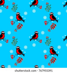 Vector seamless pattern with the image of winter, bullfinches sitting on the branches of mountain ash, snowflakes on a blue background. Great for Christmas and New year cards, packages of gifts.