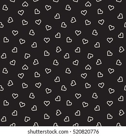 Vector seamless pattern. Inspired by Memphis Design. Randomly spaced outlines of hearts. Abstract geometric background.