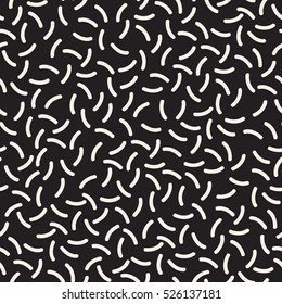 Vector seamless pattern. Inspired by Memphis Design. Trendy texture with random short lines. Abstract geometric background.