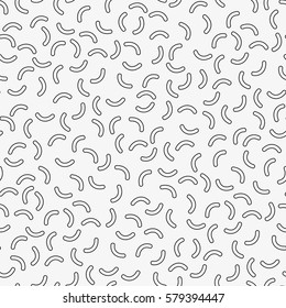 Vector seamless pattern. Inspired by Memphis Design. Trendy texture with random short lines. Abstract geometric background.