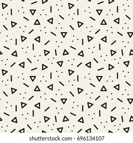 Vector seamless pattern. Inspired by Memphis Design. Randomly spaced triangles, dots and lines. Abstract geometric background. Contemporary hipster print.