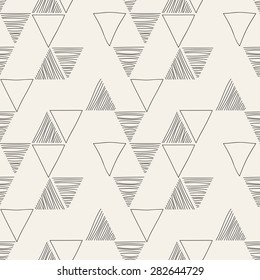 Vector seamless pattern. Irregular abstract linear triangles. Graphic hand drawn background. Doodle monochrome texture. Repeating sketch with empty and hatched triangles.
