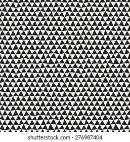 Vector seamless pattern. Irregular contrast triangles. Graphical hand drawn background. Reticulated monochrome texture. Trendy graphic design. Stylish hipster print.