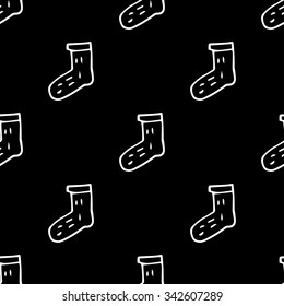 Vector seamless pattern with knitted wool socks. Hand painted background.