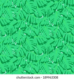Vector seamless pattern with leaves inspired by tropical nature and plants like palm trees and monstera leaf in multiple bright green colors