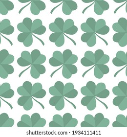 Vector seamless pattern with leaves of a lucky clover,  symbols of St. Patrick's Day. Wrapping paper, textile design, background.