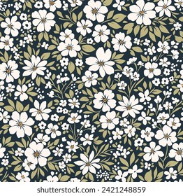 Vector seamless pattern. Liberty pattern in small flowers. Small white flowers. Black background. Trendy floral background. Ditsy template for fashion prints. Stock vector.