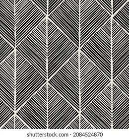 Vector seamless pattern. Linocut abstract triangles. Graphic hand drawn background. Stamped monochrome texture. Repeating print with hatched triangles.