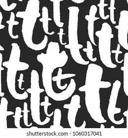 Vector seamless pattern with lowercase calligraphy letters t. Classic white on black. Clipping paths included. The texture is on Swatches Panel and the style on Graphic Styles Panel.