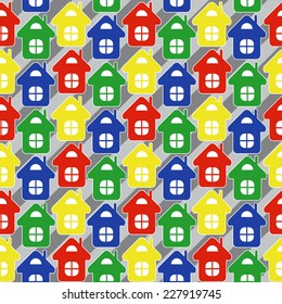 Vector seamless pattern made of multicolor simple houses