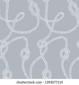 Vector seamless pattern made of twisted ropes with knots. Abstract graphic drawing. Plane nautical ornament. 