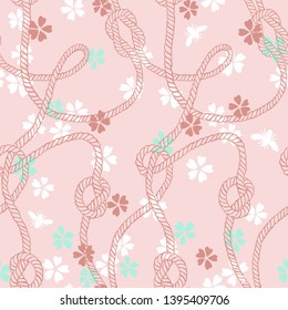 Vector seamless pattern made of twisted ropes with knots, flowers and insects. Abstract graphic drawing. Plane nautical and nature ornament. 