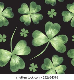 Vector seamless pattern made of watercolor clover leaves. St. Patrick Day background.