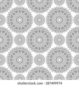 Vector, seamless pattern of mandalas. Oriental ornament of black elements on a white background. Folk tracery for wallpaper.