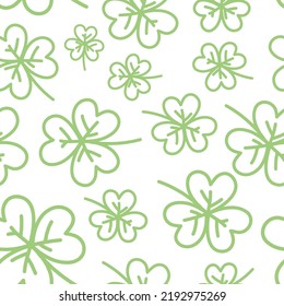 Vector seamless pattern with many pastel green clover leaves on white background. Simple decorative childish plant illustration. Trendy textile print. Spring meadow. Saint Patrick's Day celebration.
