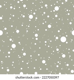 Vector seamless pattern with many simple round snowflakes on pale green background. Abstract winter concept. Decorative art element for festive Christmas layout design, packaging. New Year celebration