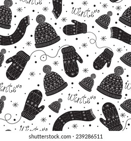 Vector seamless pattern with mittens, cap and scarf in black and white colors