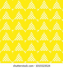 Vector seamless pattern. Modern stylish texture. Repeating geometric tiles with triangles.Small rhombuses form triangular ornament.Yellow and white