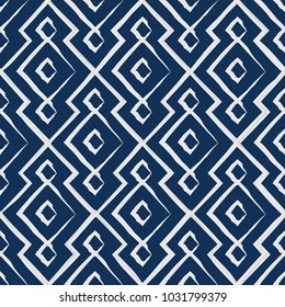 Vector seamless pattern. Modern stylish texture. Repeating abstract background. Linear grid with filled smooth rhombuses.Blue background