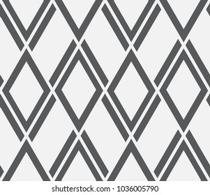   Vector seamless pattern. Modern stylish texture. Repeating geometric tiles with a grid of rhombuses.