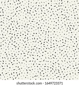 Vector seamless pattern. Modern stylish texture. Repeating abstract background with chaotic tiny polygonal spots.