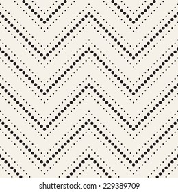 Vector seamless pattern. Modern stylish texture. Repeating geometric tiles with zigzag from circles. Monochrome dotted ornament