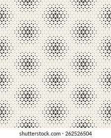 Vector seamless pattern. Modern stylish texture. Repeating tiles from small triangles. Monochrome halftone grid with different sized triangles. Geometric hipster background