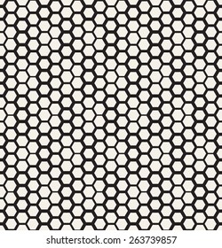 Vector seamless pattern. Modern stylish texture. Repeating geometric tiles with dotted triangles. Regular monochrome background. Different sized hexagons form stylish minimalistic ornament.