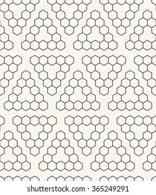 Vector seamless pattern. Modern stylish texture. Repeating tiles from small hexagons. Monochrome ornament with hexagons which form triangles. Geometric hipster background.