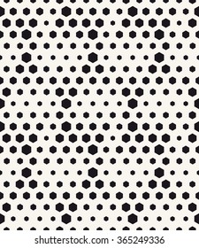 Vector seamless pattern. Modern stylish texture. Repeating tiles from small hexagons. Monochrome halftone grid with different sized hexagons which form triangles. Geometric hipster background.