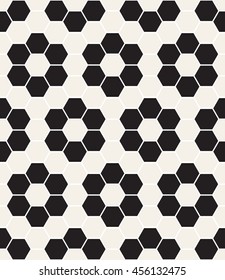Vector seamless pattern. Modern stylish texture. Reticulated geometric tiles. Geometric hexagonal grid background with filled flowers.