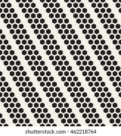 Vector seamless pattern. Modern stylish texture. Repeating background with hexagons. Geometric monochrome background. Minimalistic simple design. Filled hexagonal shapes form diagonal stripes.