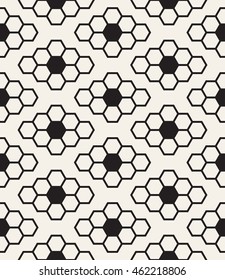 Vector seamless pattern. Modern stylish texture. Repeating background with hexagons. Geometric monochrome background. Minimalistic simple design. Hexagonal shapes form rhombuses.