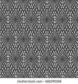Vector seamless pattern. Modern stylish texture. Repeating geometric tiles with dotted triangles. Regular hipster background. Small triangles form halftone rhombuses. Contemporary simple ornament